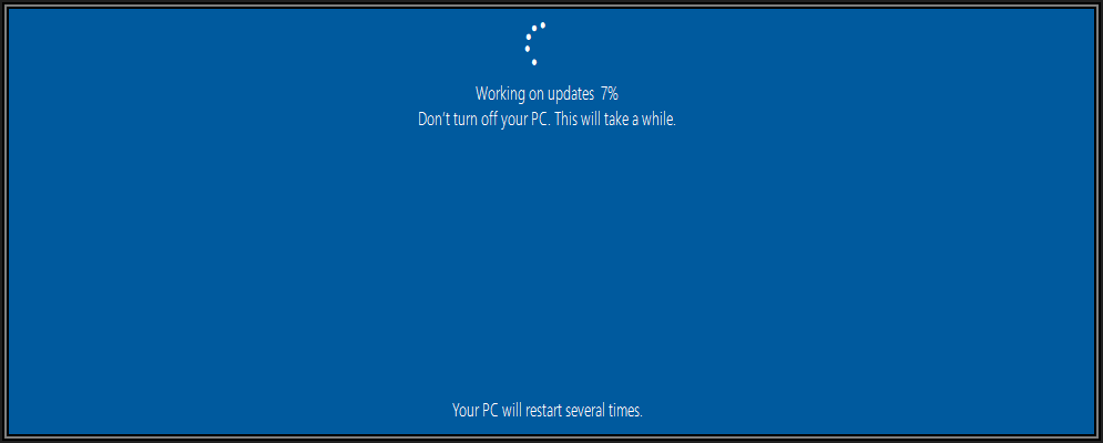 Screenshot showing additional progress of updates being downloaded and advising Your PC will restart several times.